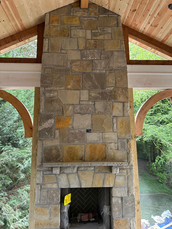 natural stone outdoor fireplace